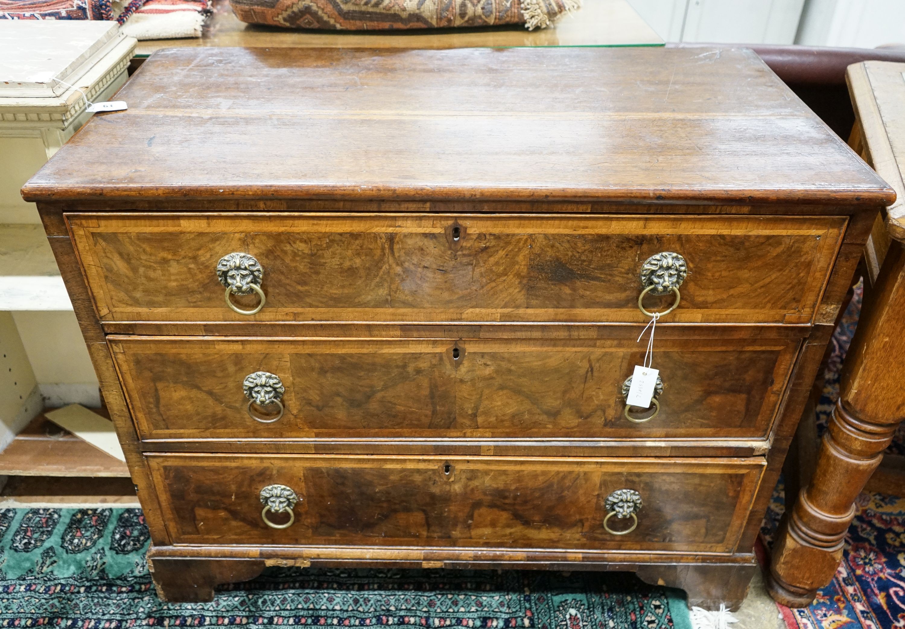 A walnut and oak chest of drawers, width 103cm, depth 52cm, height 82cm